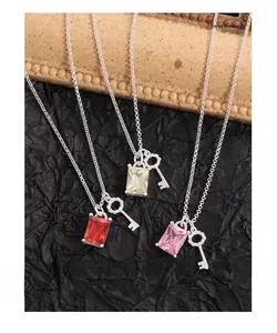Detailed close-up of S925 silver key necklaces with colorful zircon stones