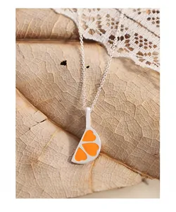 Close-up of S925 silver necklace with orange heart enamel orange slice pendant