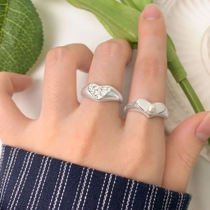 S925 sterling silver heart rings with pearl and floral patterns worn on fingers