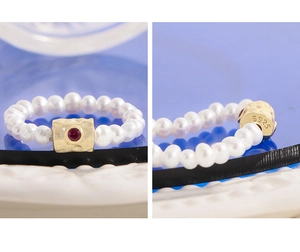 Macro view of S925 sterling silver hallmark and natural freshwater pearl band details