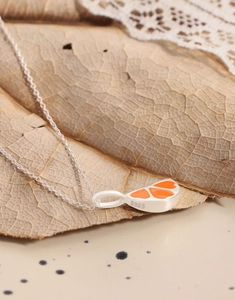 Detail of S925 silver necklace featuring an orange enamel citrus slice pendant with S925 stamp