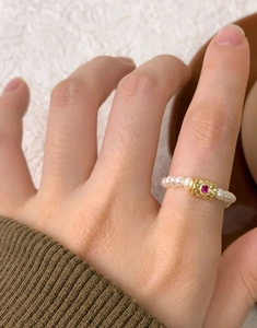 Close-up of S925 silver beaded ring with freshwater pearls and pink gemstone detail
