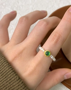 Detailed close-up of a vintage S925 silver ring with green agate and natural freshwater pearls