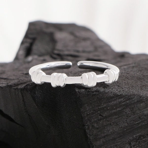 Minimalist S925 sterling silver spiral ring with textured knots on charcoal background