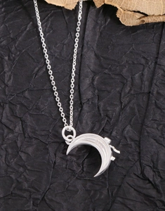 Macro shot of S925 hallmark on the silver crescent moon pendant with fine chain