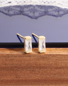 Macro shot of S925 silver stamp on gold plated baguette cut rectangle stud earrings