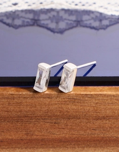 Macro shot of S925 sterling silver stamp and emerald cut cubic zirconia on stud earrings