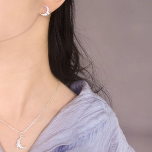 Elegant S925 sterling silver crescent moon necklace and earring set on female model