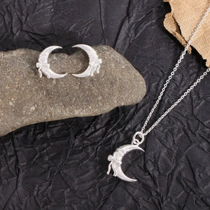 Minimalist S925 silver crescent moon jewelry set with bow details and polished finish