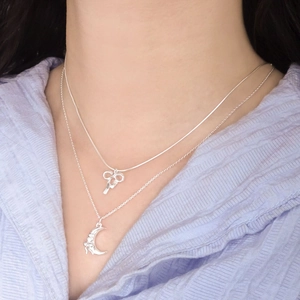 Elegant S925 sterling silver layered necklace with butterfly and crescent moon pendants