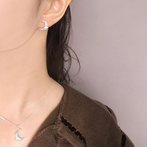 S925 silver moon bow jewelry set including earrings and necklace shown on a model