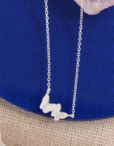 Detailed view of S925 sterling silver butterfly pendant with engraved hallmark