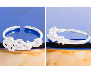 Macro detail of S925 sterling silver stamp on the inner band of the knotted ring