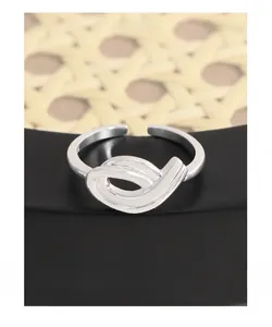 Macro shot of S925 sterling silver stamp on minimalist hollow twisted open ring