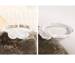 Detail shot of multilayer S925 sterling silver ring showing adjustable knot and hallmark