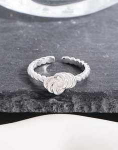 Macro view of S925 sterling silver twisted rope ring with adjustable open design