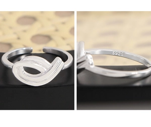 Detail view of S925 sterling silver hollow ring with engraved hallmark and adjustable band