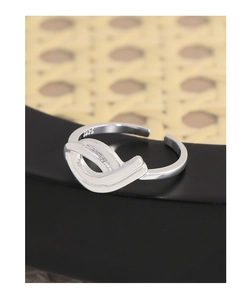 Detail view of the S925 sterling silver stamp on the inner band of the hollow ribbon ring