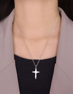 On-neck view of S925 sterling silver cross necklace with sparkling cubic zirconia