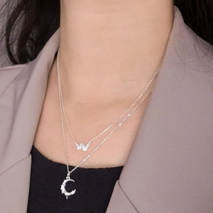 S925 sterling silver layered necklace with butterfly and crescent moon pendants on model