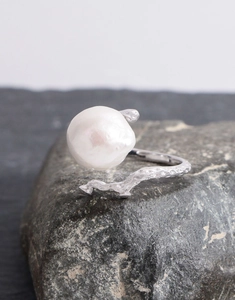 Macro detail of S925 silver twig ring featuring a large baroque pearl and zircon accents
