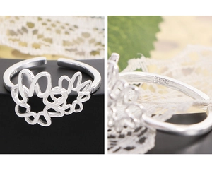 Macro detail of S925 sterling silver stamp on minimalist hollow flower ring