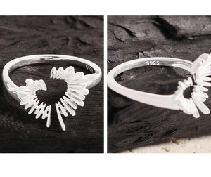Macro detail of S925 sterling silver stamp on irregular heart-shaped radiating ring