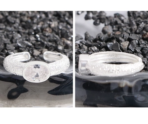 Detail view of oval cubic zirconia stone and hammered texture on S925 sterling silver ring