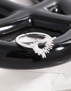 Macro shot of S925 sterling silver stamp on the inner band of irregular heart ring