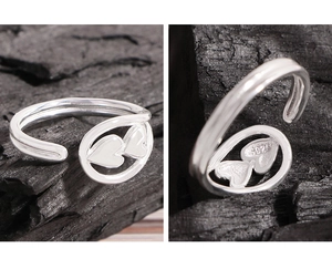Macro detail of S925 sterling silver stamp on minimalist double heart open ring