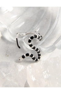 Macro detail of S925 sterling silver snake ring with black enamel striped pattern
