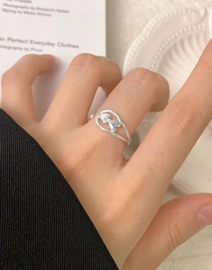 Close-up of minimalist S925 sterling silver open ring with double hollow heart design