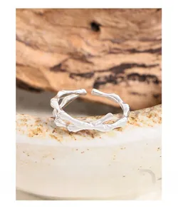 Close-up of S925 sterling silver ring with bamboo joint texture and crossover design