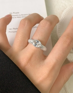 Close-up of S925 silver ring with oval zircon gemstone and hammered texture detail