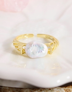 Detail of S925 silver stamp on gold-plated band with white baroque pearl