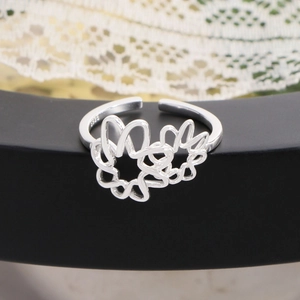 Minimalist S925 sterling silver open ring with hollow mesh flower design on a black stand