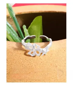 Macro detail of S925 sterling silver hollow star ring with fine hallmark engraving
