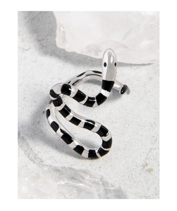 Macro shot of S925 sterling silver snake ring with black striped enamel on white rock
