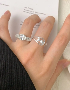Detail of S925 sterling silver hammered ring with oval zircon and heart wave band