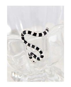 Macro detail of S925 sterling silver snake ring with black enamel striped finish