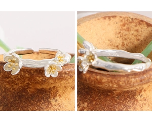 Detail of S925 hallmark on sterling silver adjustable flower ring with gold plating