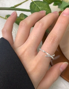 Close-up of S925 sterling silver bamboo knot ring worn on finger for a minimalist look