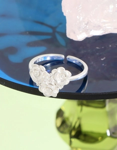 Detail of S925 sterling silver ring with three miniature roses and adjustable opening