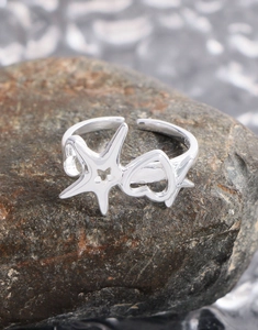 Macro view of S925 sterling silver open ring with hollow heart and star pattern engraving