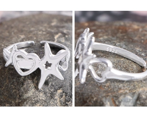 Detailed macro view showing S925 hallmark on sterling silver hollow star and heart ring