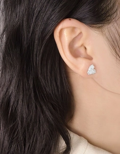 Close-up of elegant butterfly stud earrings with silver finish and pavé cubic zirconia