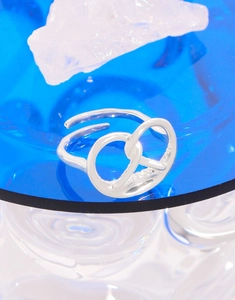 Macro detail of S925 sterling silver pretzel ring with micro-pave crystals