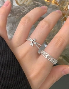 Detail showing S925 silver moth ring with red zircon and hollow butterfly band on hand