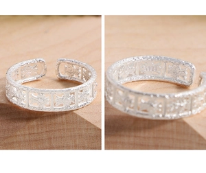 Detailed macro view showing S925 hallmark on silver hollow textured open ring band