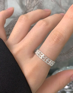 Detailed macro view of S925 sterling silver wide hollow ring with floral patterns